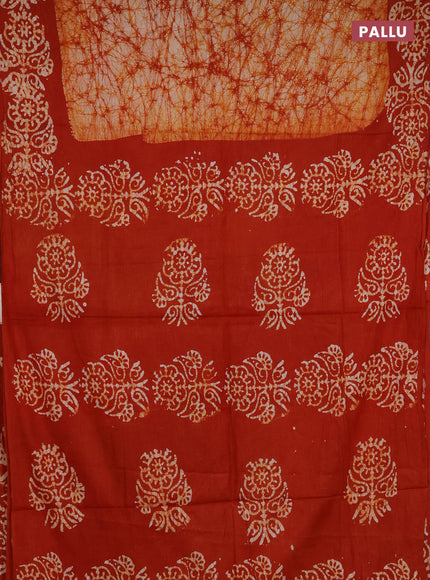 Batik cotton saree orange with allover prints and batik printed border