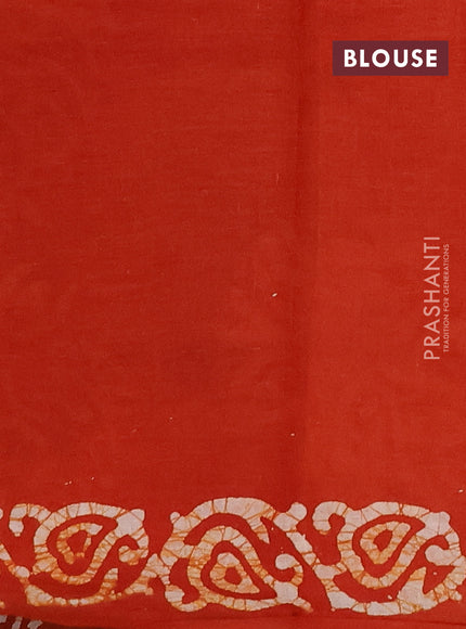 Batik cotton saree orange with allover prints and batik printed border