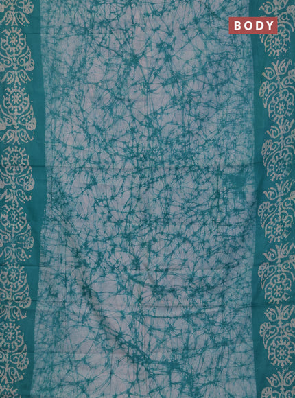 Batik cotton saree teal green with allover prints and batik printed border