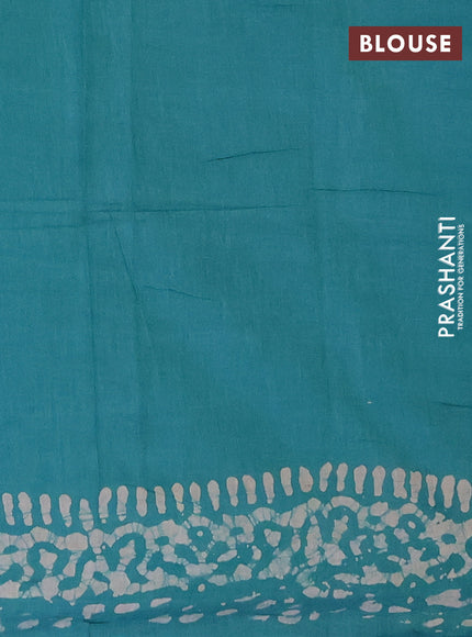 Batik cotton saree teal green with allover prints and batik printed border