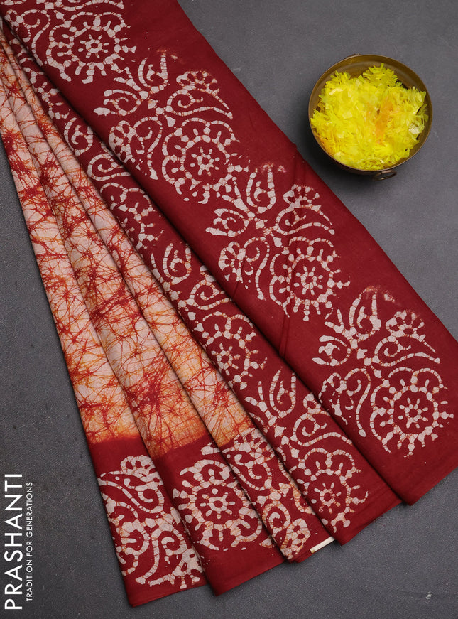 Batik cotton saree beige and deep maroon with allover prints and batik printed border
