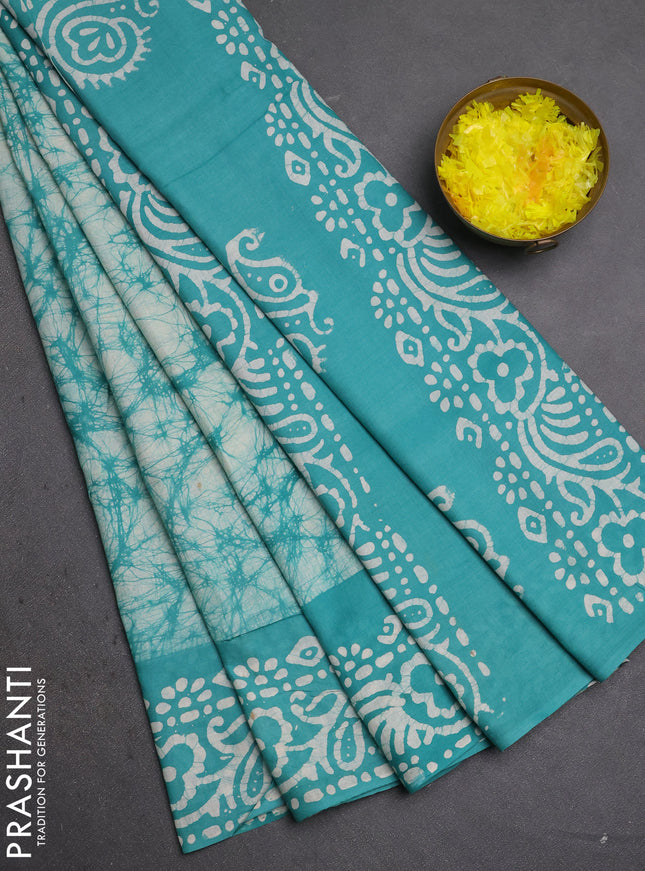Batik cotton saree teal green with allover prints and batik printed border