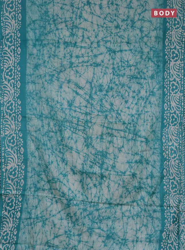 Batik cotton saree teal green with allover prints and batik printed border