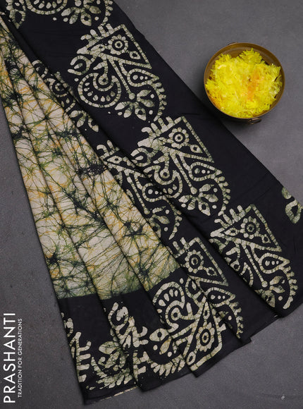 Batik cotton saree beige and black with allover prints and batik printed border