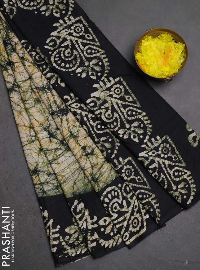 Batik cotton saree beige and black with allover prints and batik printed border