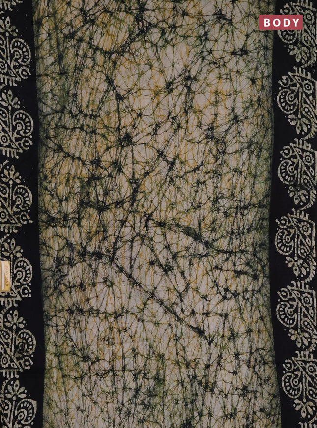 Batik cotton saree beige and black with allover prints and batik printed border