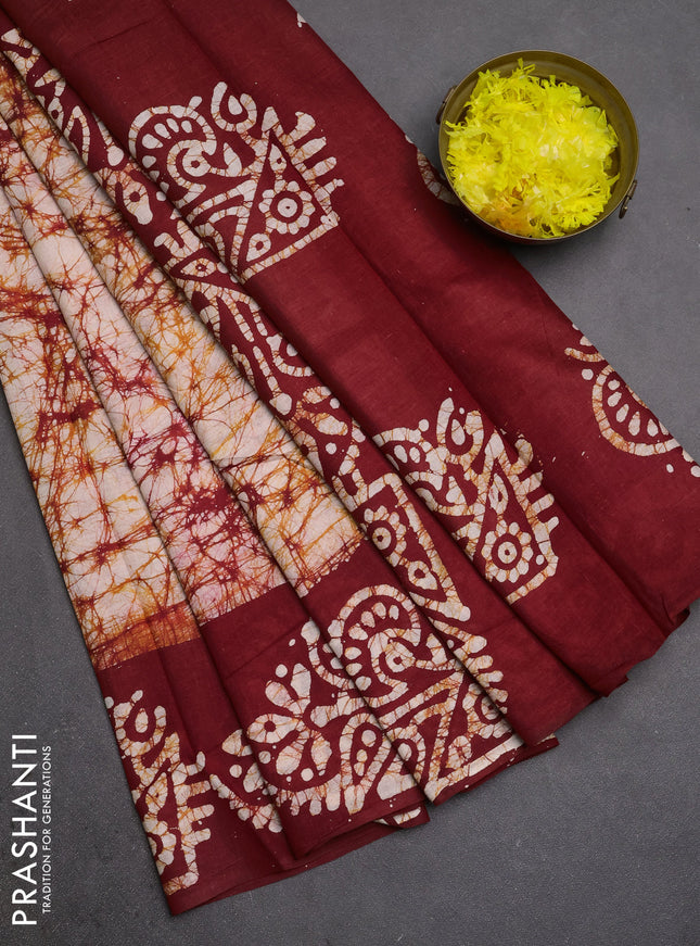 Batik cotton saree off white and maroon with allover prints and batik printed border