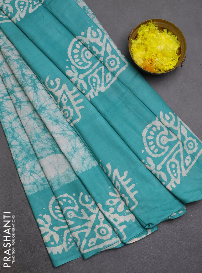 Batik cotton saree teal green with allover prints and batik printed border