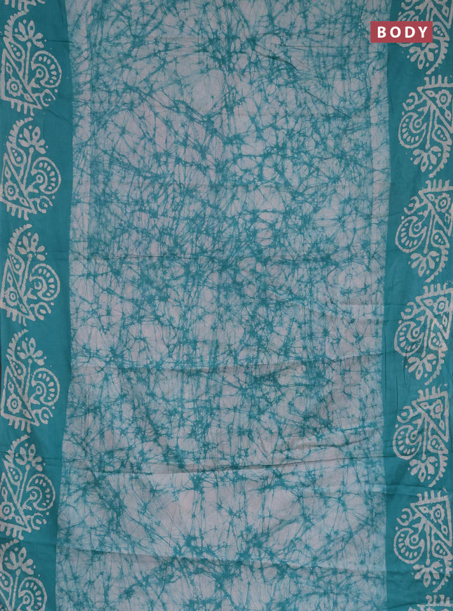 Batik cotton saree teal green with allover prints and batik printed border