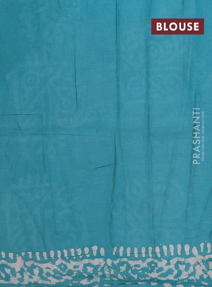 Batik cotton saree teal green with allover prints and batik printed border