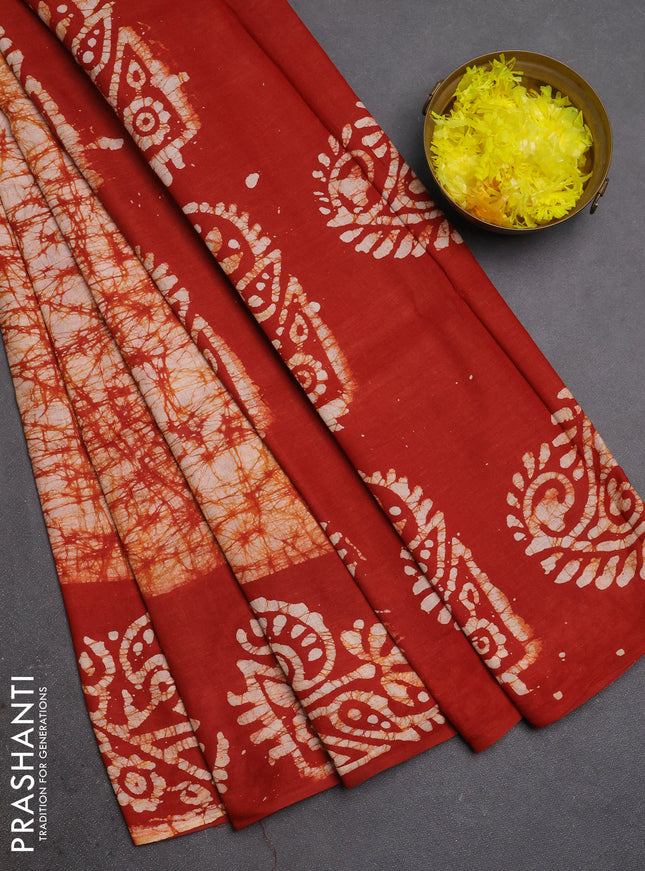 Batik cotton saree rust shade with allover prints and batik printed border