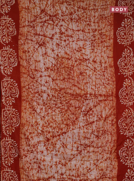 Batik cotton saree rust shade with allover prints and batik printed border