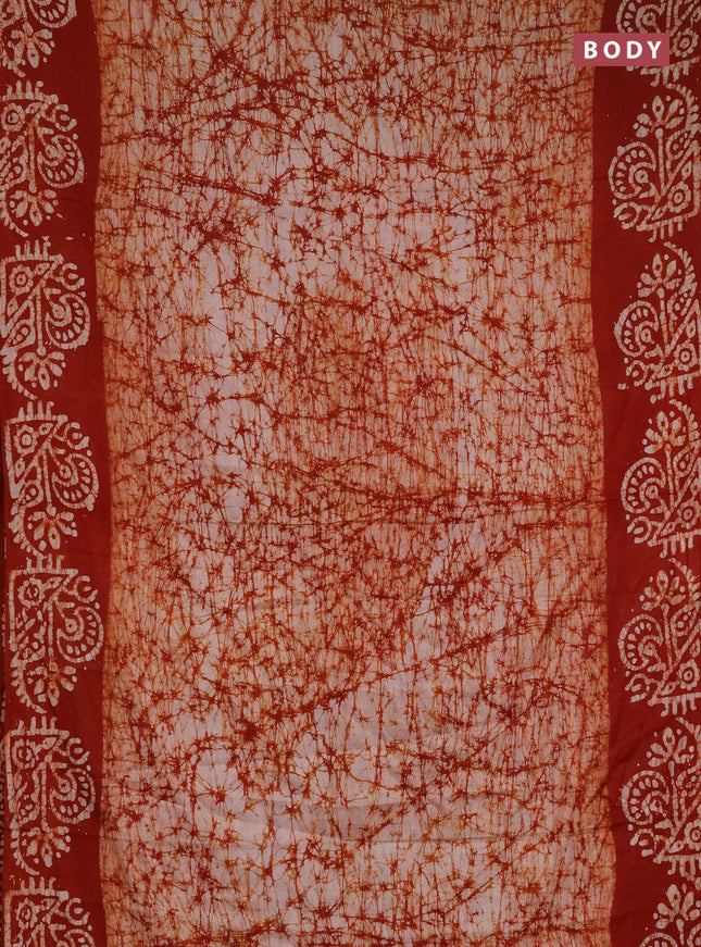 Batik cotton saree rust shade with allover prints and batik printed border