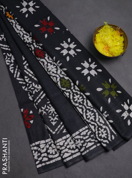 Batik cotton saree black with allover prints and batik printed border