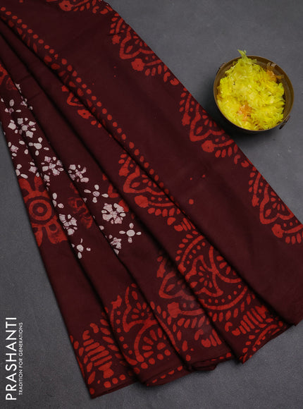 Batik cotton saree deep maroon with allover prints and batik printed border