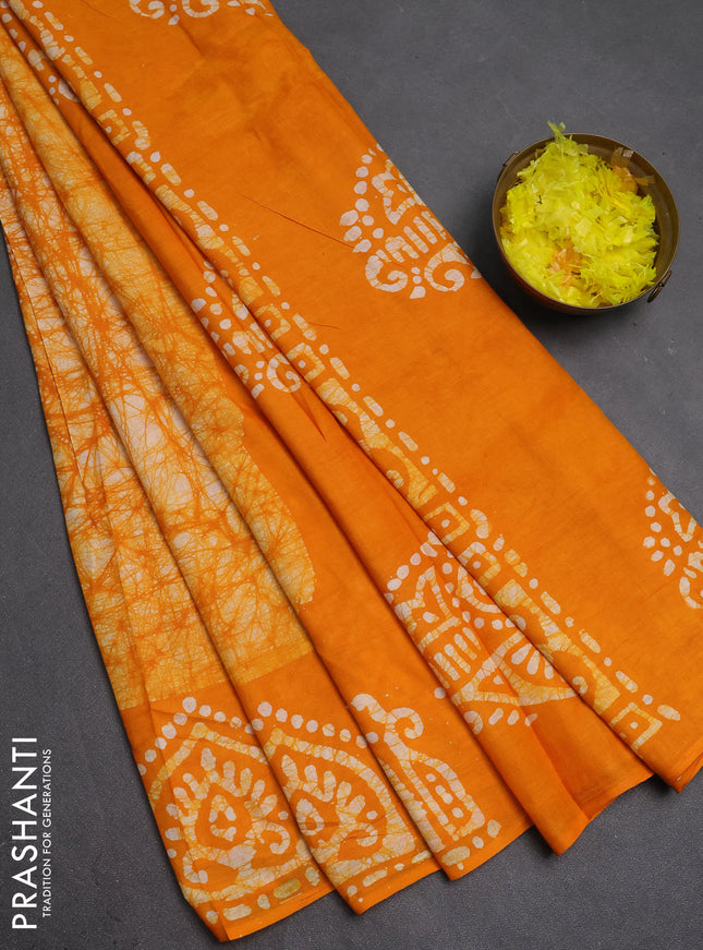 Batik cotton saree mango yellow with allover prints and batik printed border