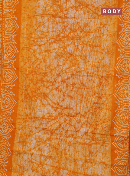 Batik cotton saree mango yellow with allover prints and batik printed border