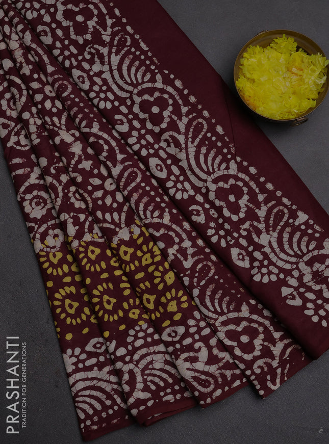 Batik cotton saree deep wine shade with allover prints and batik printed border