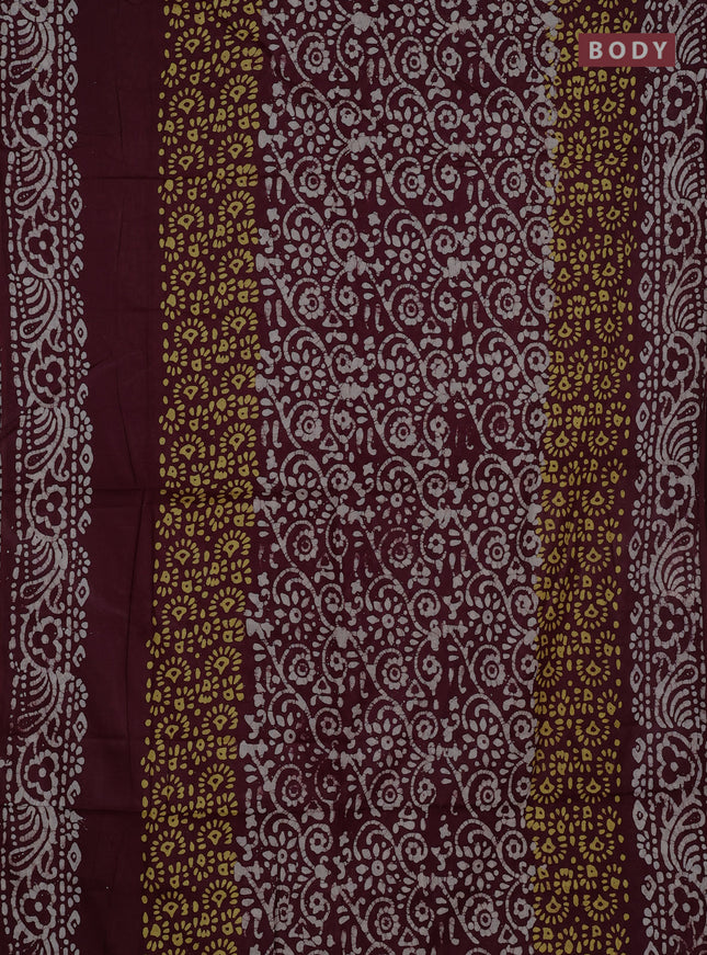 Batik cotton saree deep wine shade with allover prints and batik printed border
