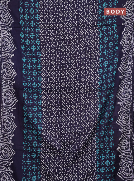 Batik cotton saree teal green and navy blue with allover prints and batik printed border