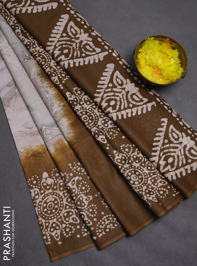 Batik cotton saree multi colour and mehendi green with allover prints and batik printed border