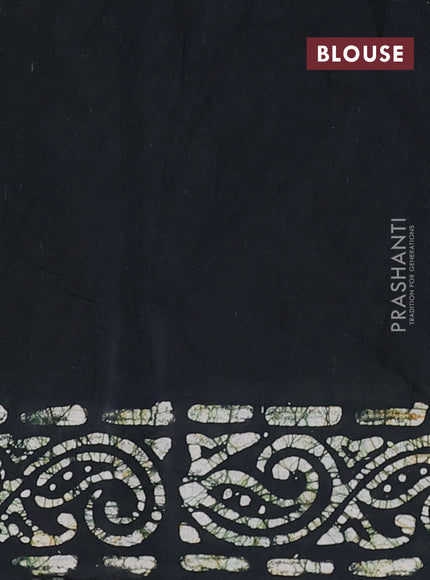 Batik cotton saree bottle green with allover prints and batik printed border