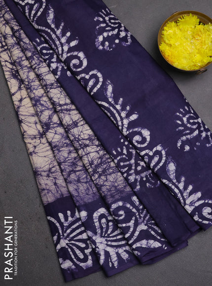 Batik cotton saree beige and navy blue with allover prints and batik printed border