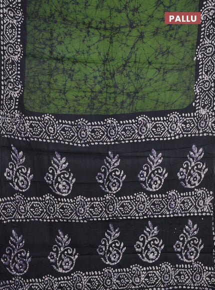Batik cotton saree green with allover prints and batik printed border