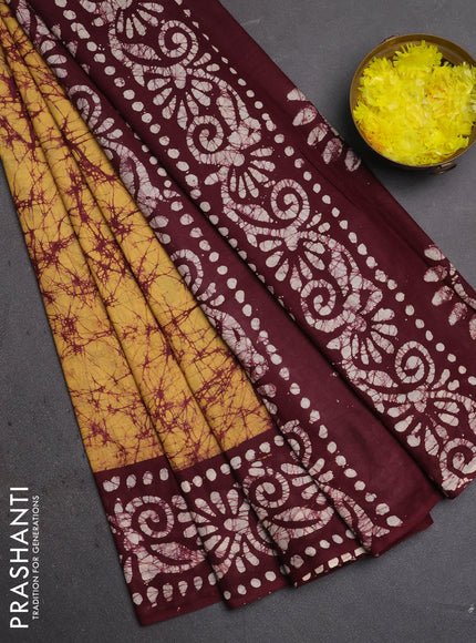 Batik cotton saree mustard yellow and deep maroon with allover prints and batik printed border