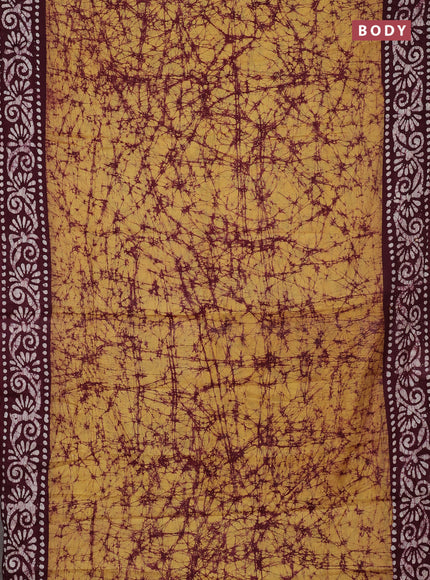 Batik cotton saree mustard yellow and deep maroon with allover prints and batik printed border