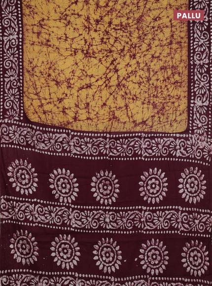 Batik cotton saree mustard yellow and deep maroon with allover prints and batik printed border
