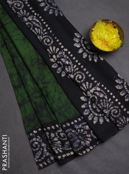 Batik cotton saree mehendi green and black with allover prints and batik printed border