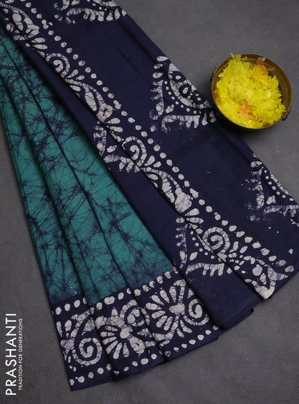 Batik cotton saree green shade and navy blue with allover prints and batik printed border