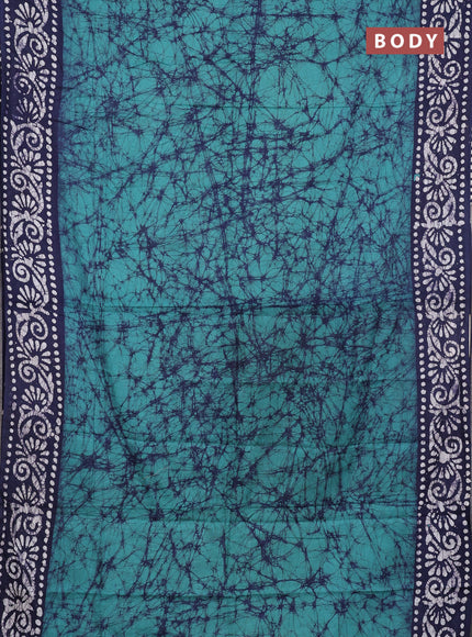 Batik cotton saree green shade and navy blue with allover prints and batik printed border
