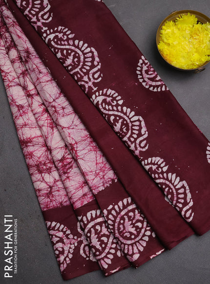 Batik cotton saree off white and wine shade with allover prints and batik printed border