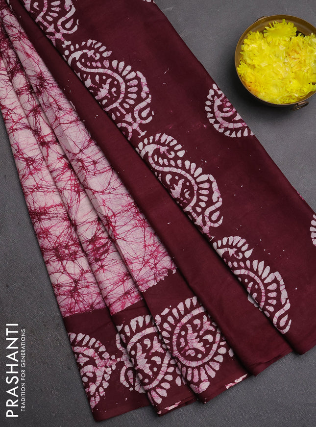 Batik cotton saree off white and wine shade with allover prints and batik printed border