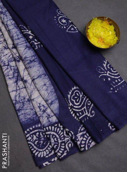 Batik cotton saree off white and navy blue with allover prints and batik printed border