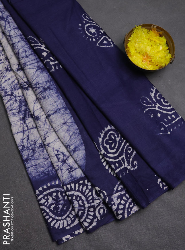 Batik cotton saree off white and navy blue with allover prints and batik printed border