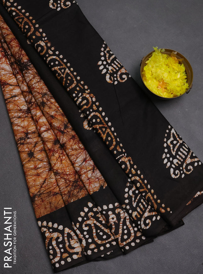 Batik cotton saree dark mustard and coffee brown with allover prints and batik printed border