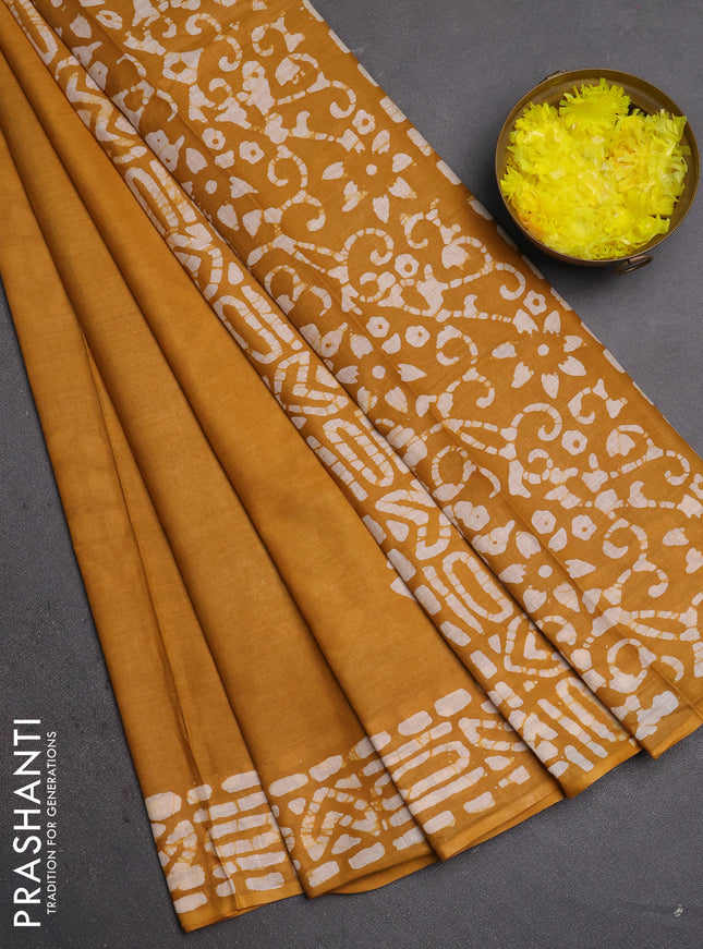 Batik cotton saree mustard yellow with batik butta prints and batik printed border