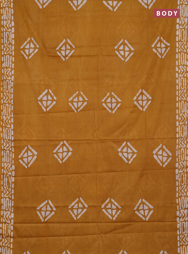 Batik cotton saree mustard yellow with batik butta prints and batik printed border
