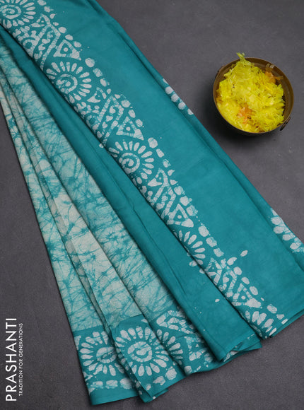 Batik cotton saree teal green with allover prints and batik printed border