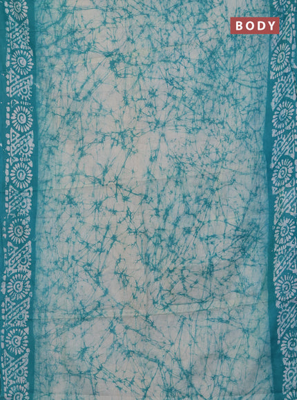 Batik cotton saree teal green with allover prints and batik printed border