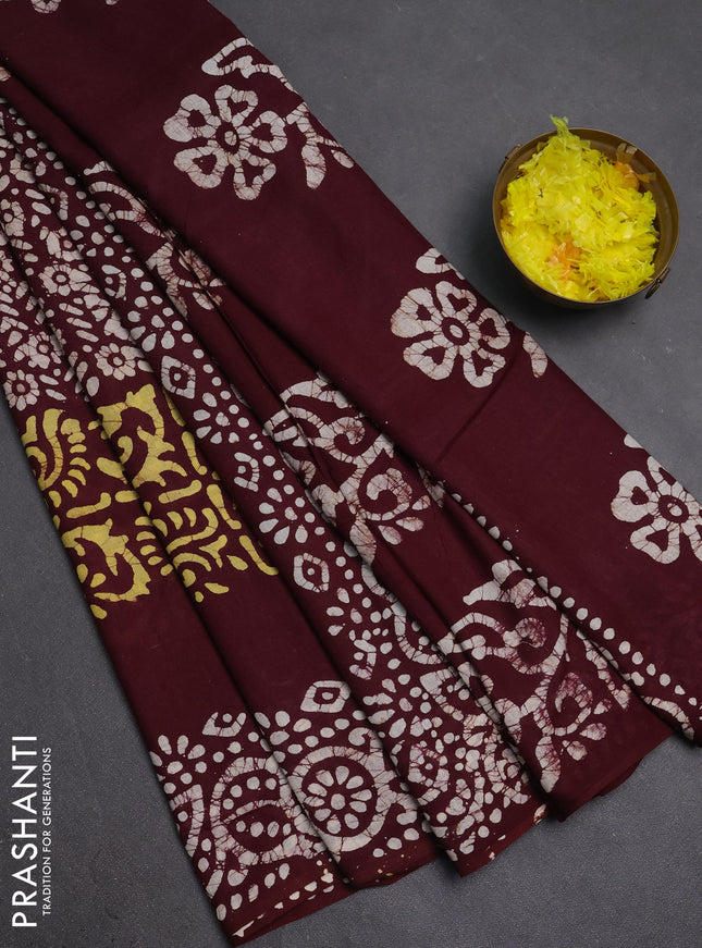 Batik cotton saree deep wine shade with allover prints and batik printed border