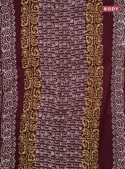 Batik cotton saree deep wine shade with allover prints and batik printed border