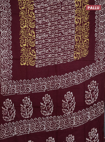 Batik cotton saree deep wine shade with allover prints and batik printed border