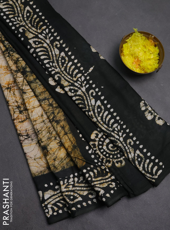 Batik cotton saree mustard yellow and bottle green with allover prints and batik printed border