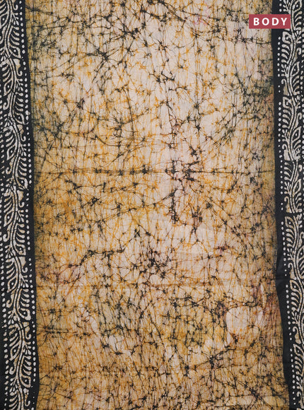 Batik cotton saree mustard yellow and bottle green with allover prints and batik printed border