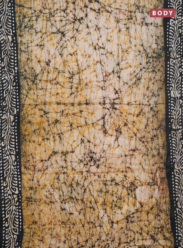 Batik cotton saree mustard yellow and bottle green with allover prints and batik printed border