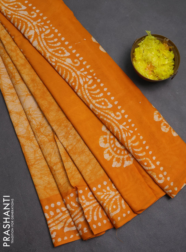 Batik cotton saree mango yellow with allover prints and batik printed border